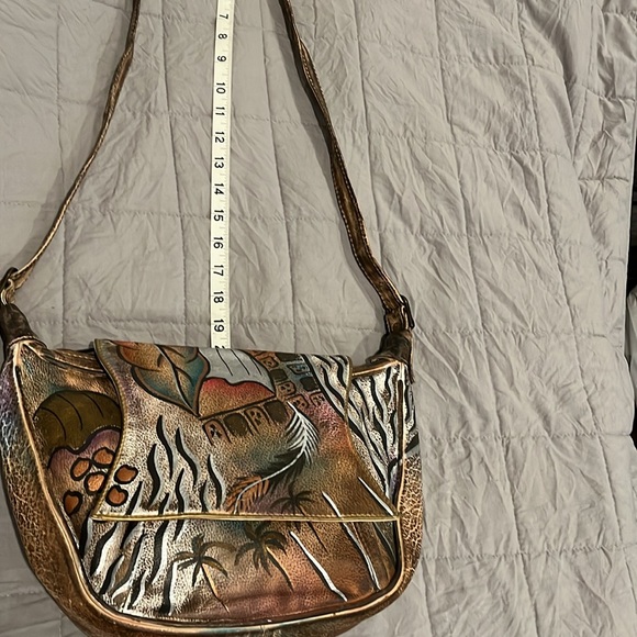 Sova Hand-painted Leather Crossbody. Never  used. Earth tone with silver accent - Picture 10 of 15